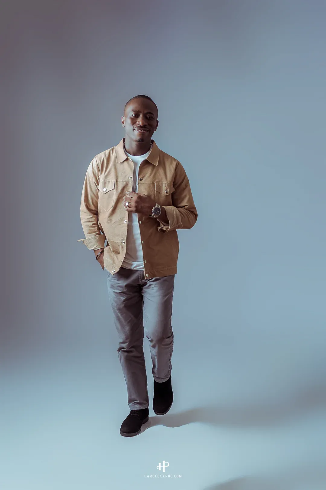 David Nkennor standing in a full length studio portrait.